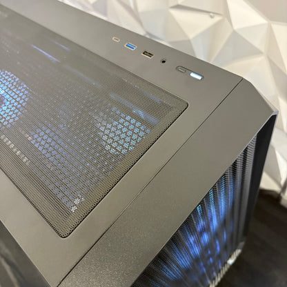 Computer case with mesh front panel and visible cooling system on a white geometric background