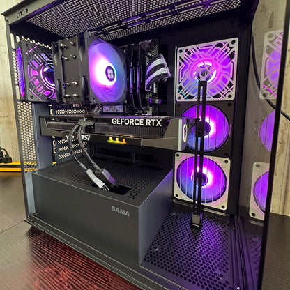 Open computer case with visible components and purple lighting