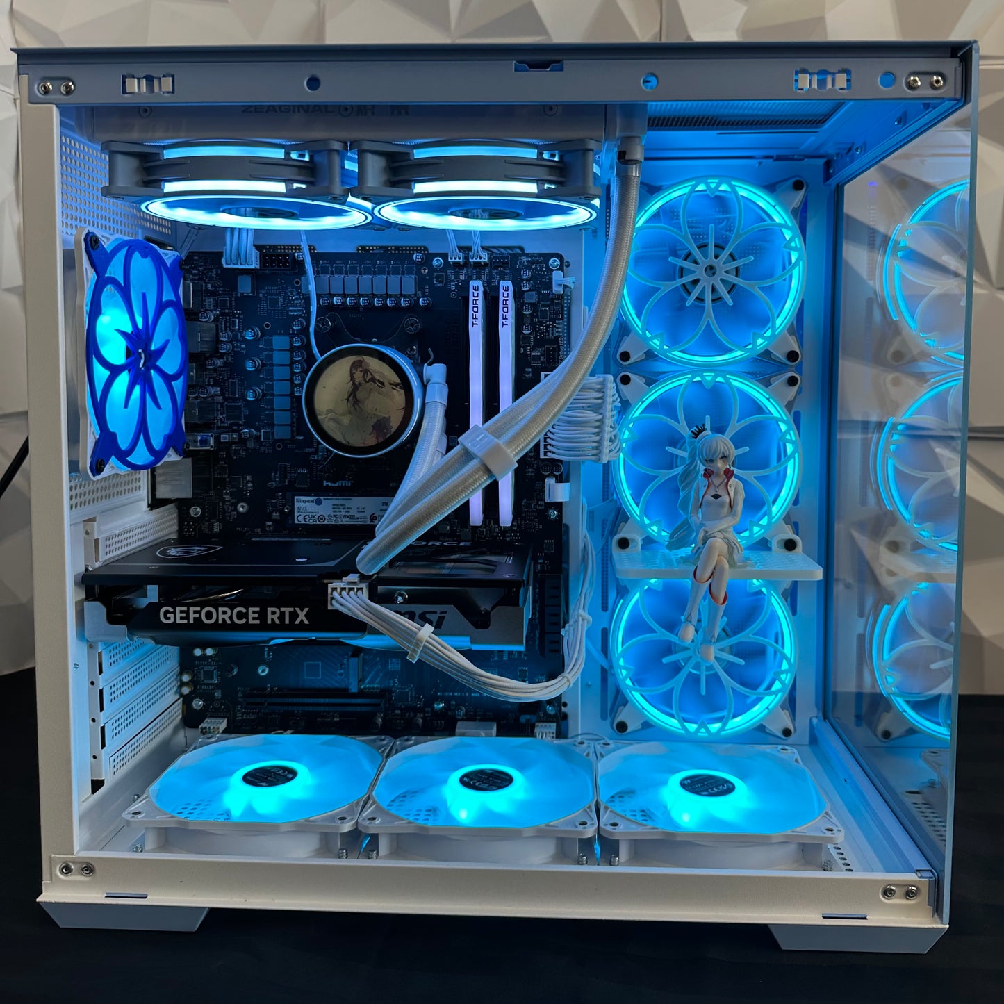 Open computer case with blue LED lights and visible components