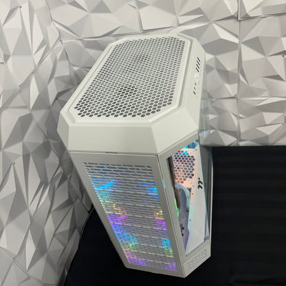 Hexagonal computer case with colorful LED lighting against a geometric patterned wall.