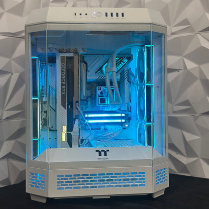 Computer case with transparent side panel showcasing internal components against a geometric-patterned wall.