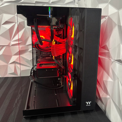 Open computer case with red lighting on a geometric patterned wall background